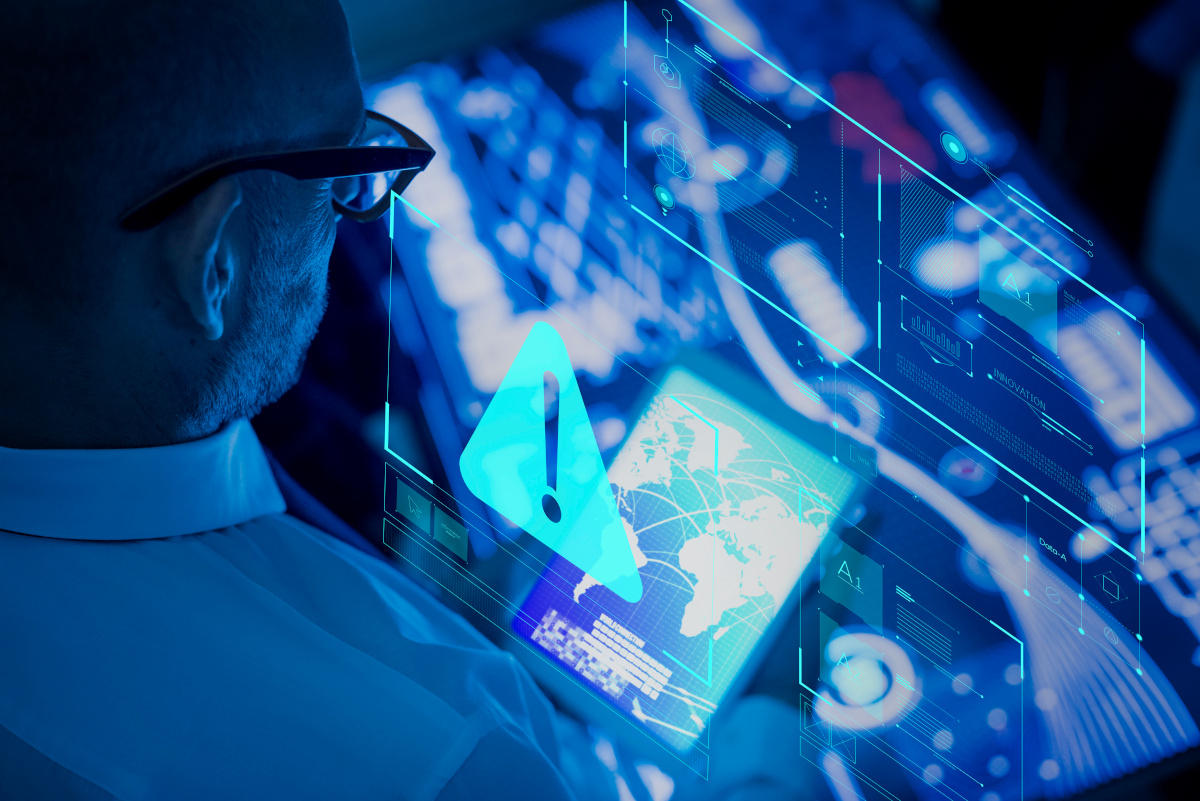 A businessman looking at a futuristic display of monitoring systems for data networks