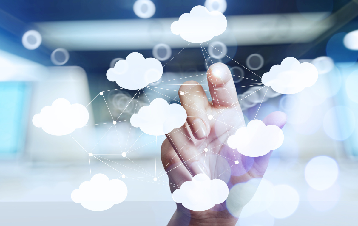 A hand touching a digital display of clouds