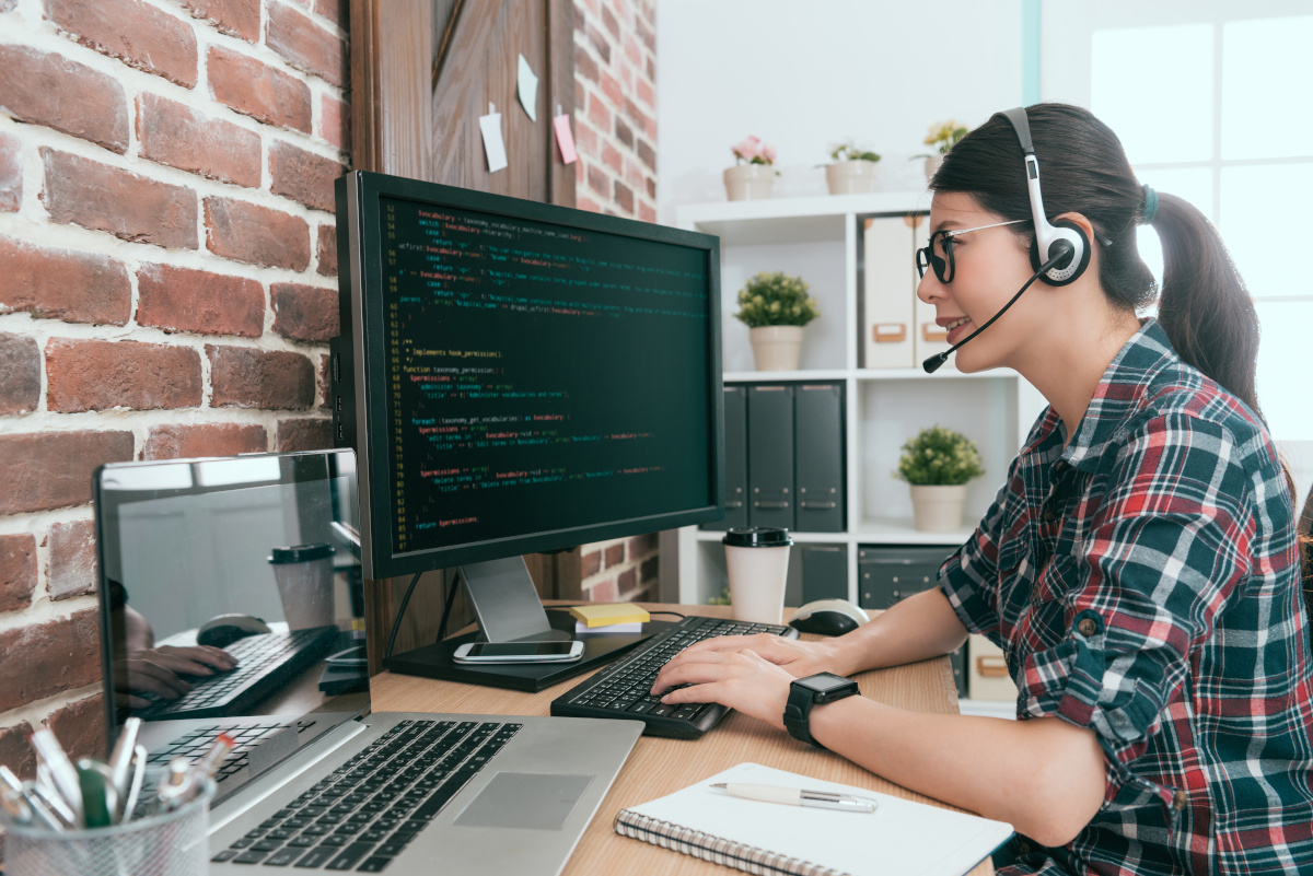 Woman in Headset on Computer at Home Office