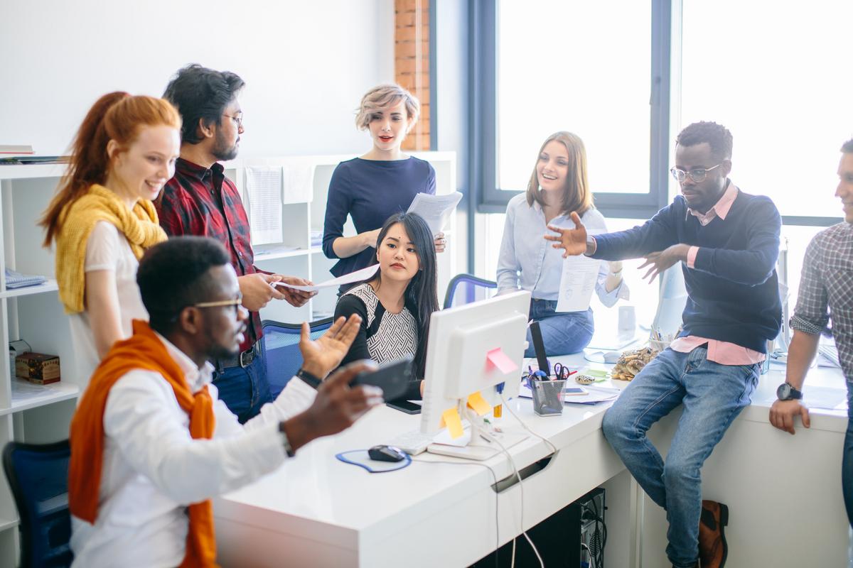  Young Business People Brainstorming in an Office